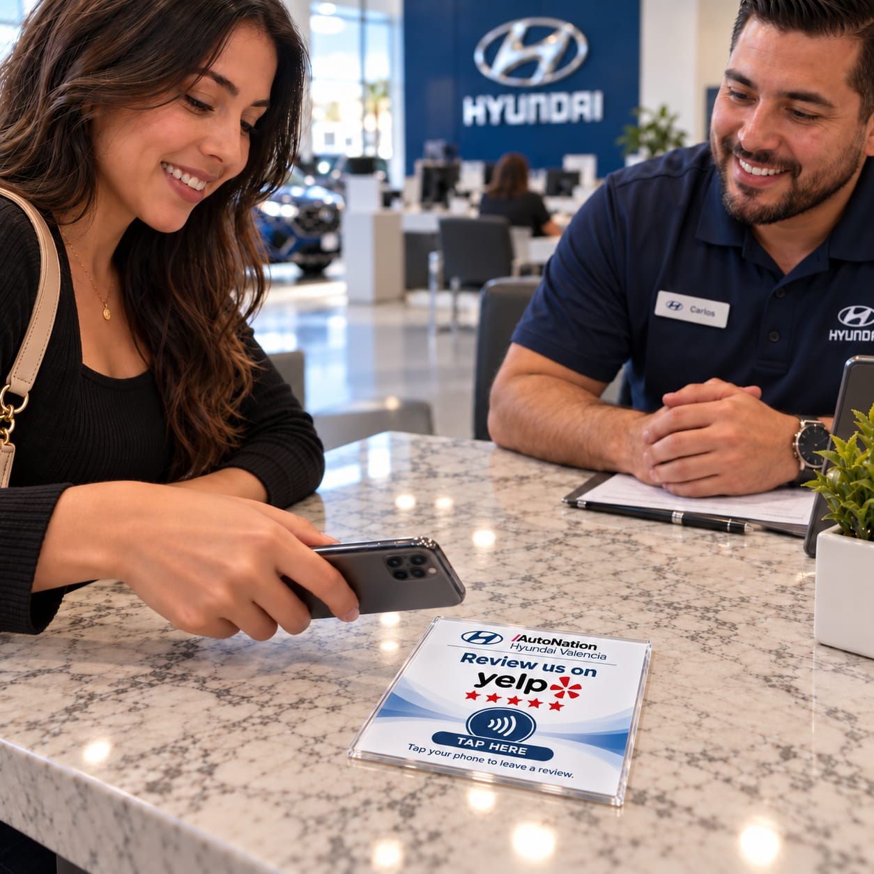 Customer using a review sign at a Hyundai dealership